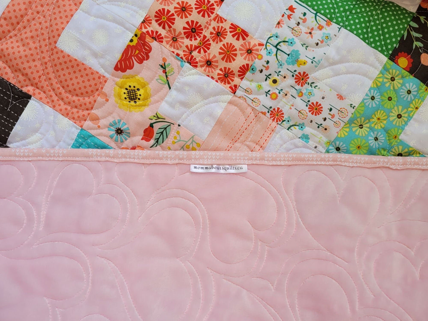 showing soft minky back of baby quilt