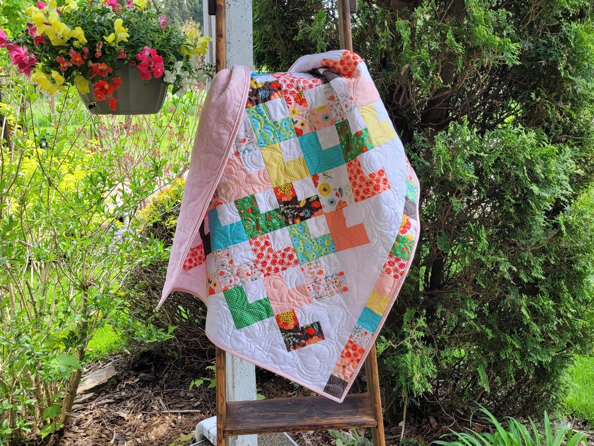 bright baby girl quilt in pretty floral fabrics