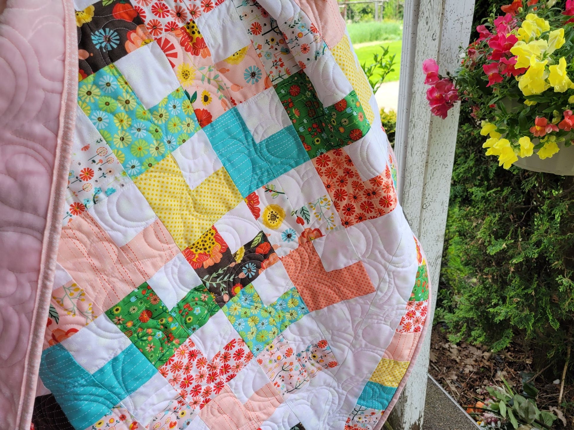 close up of baby quilt showing heart stitching