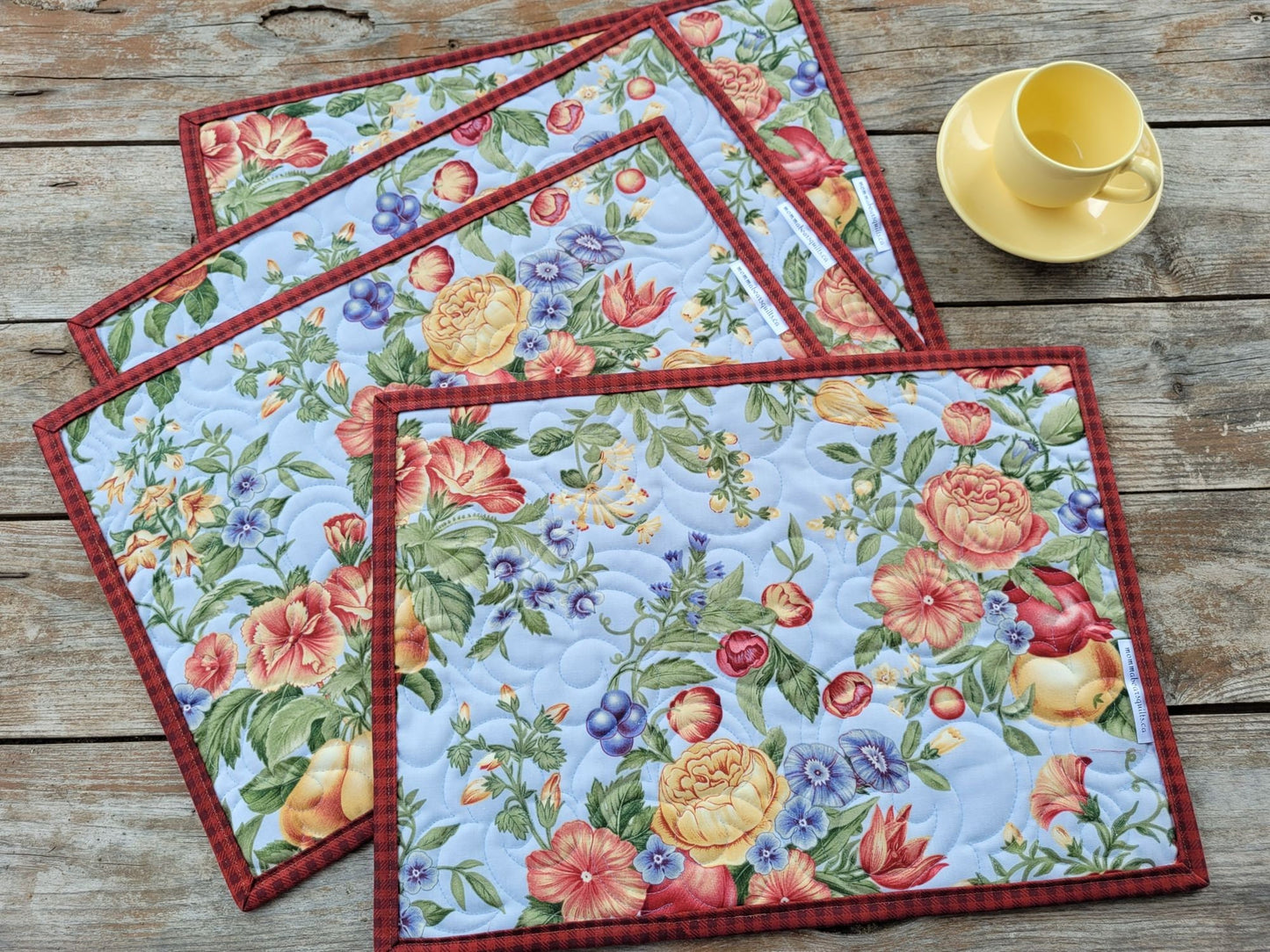 reversible side of quilted placemat set has lovely floral print
