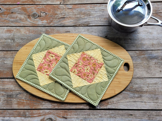 quilted potholders in green and yellow cotton prints