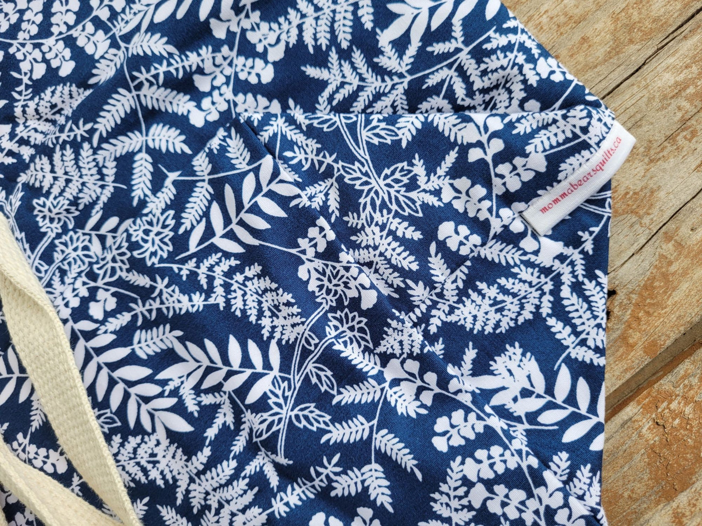 closeup view of navy botanical leaf fabric