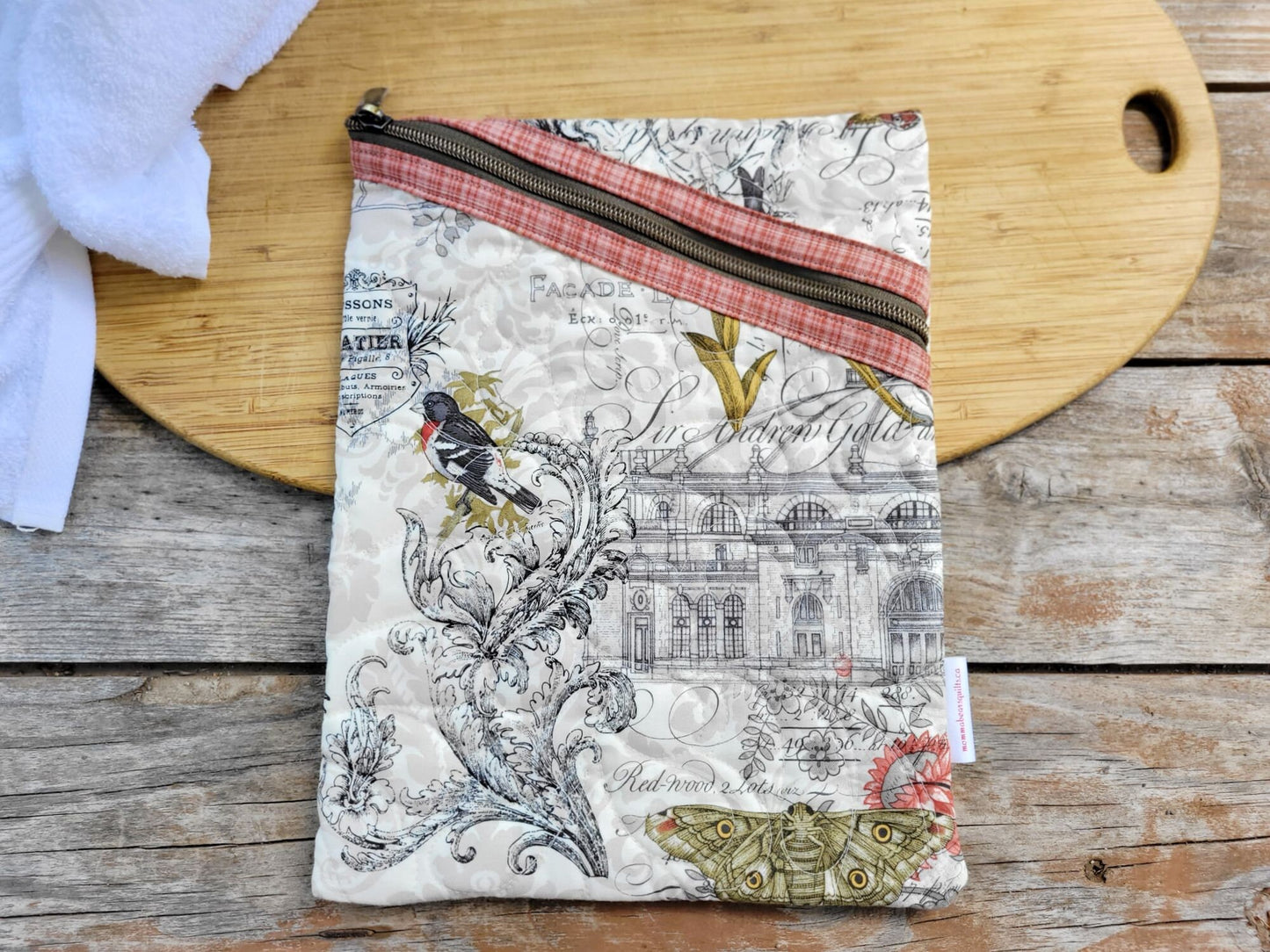 beige zipper pouch with art theme fabric