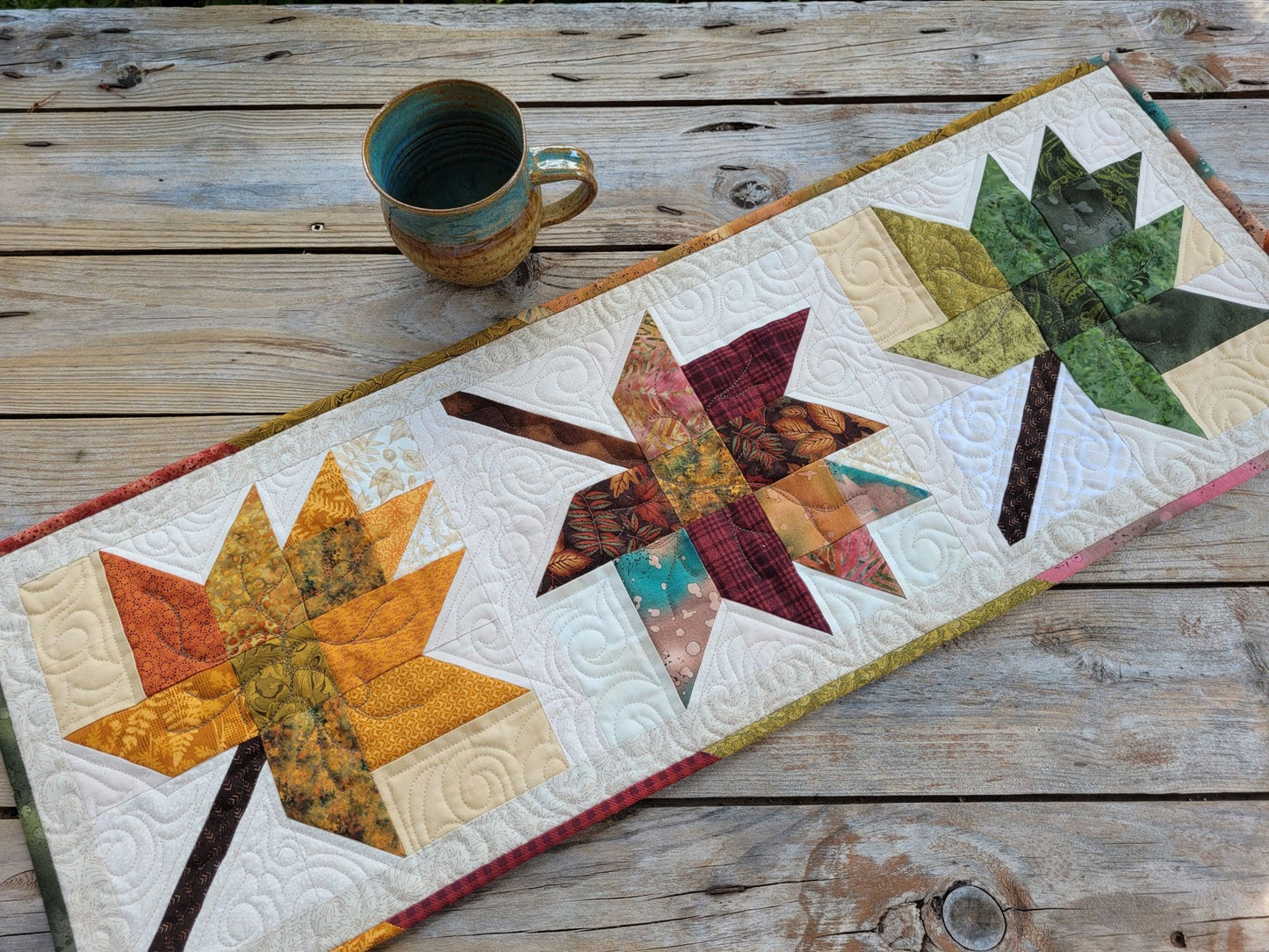 quilted table runner with fall leaves