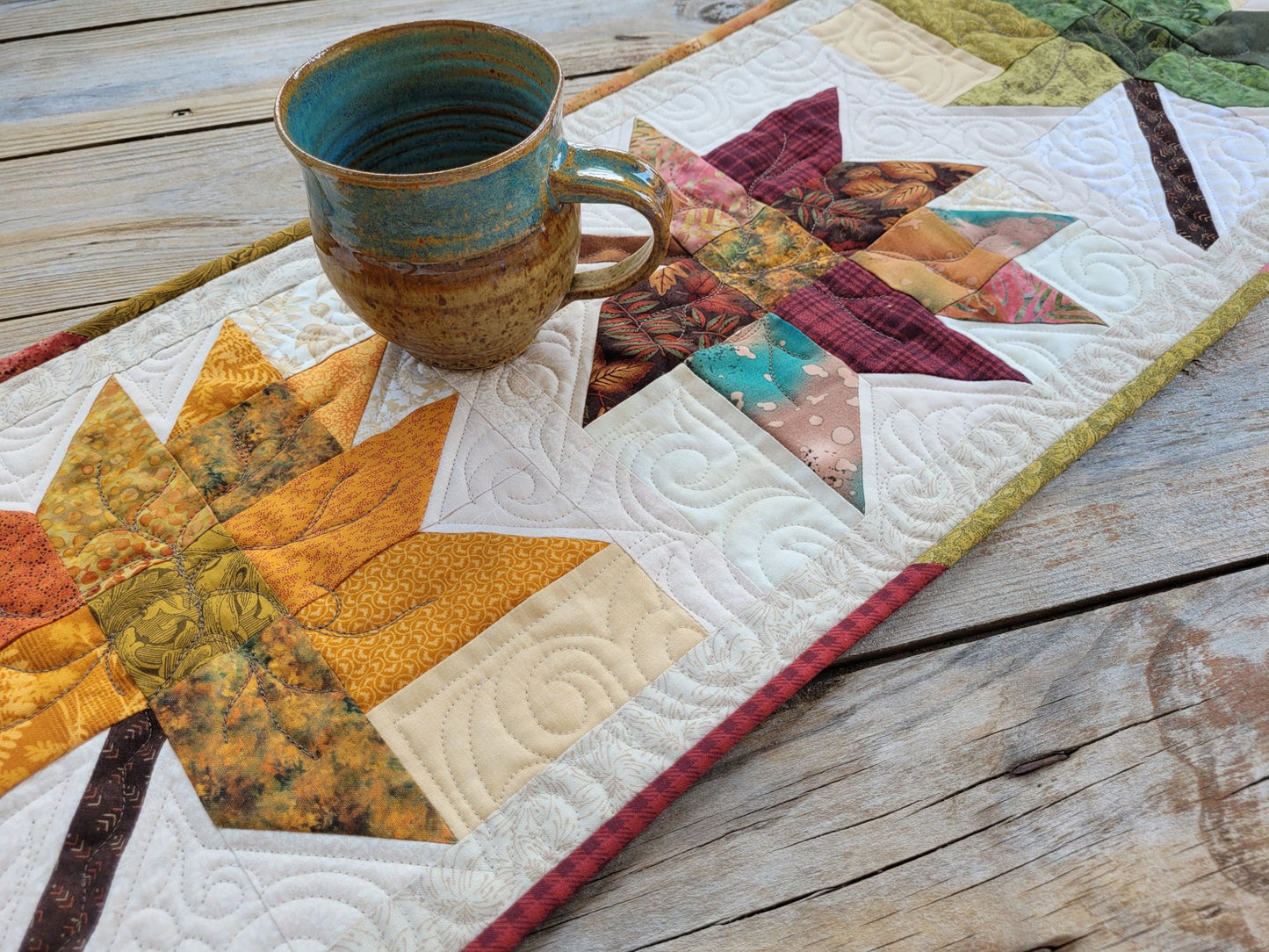 quilted table runner with fall leaves