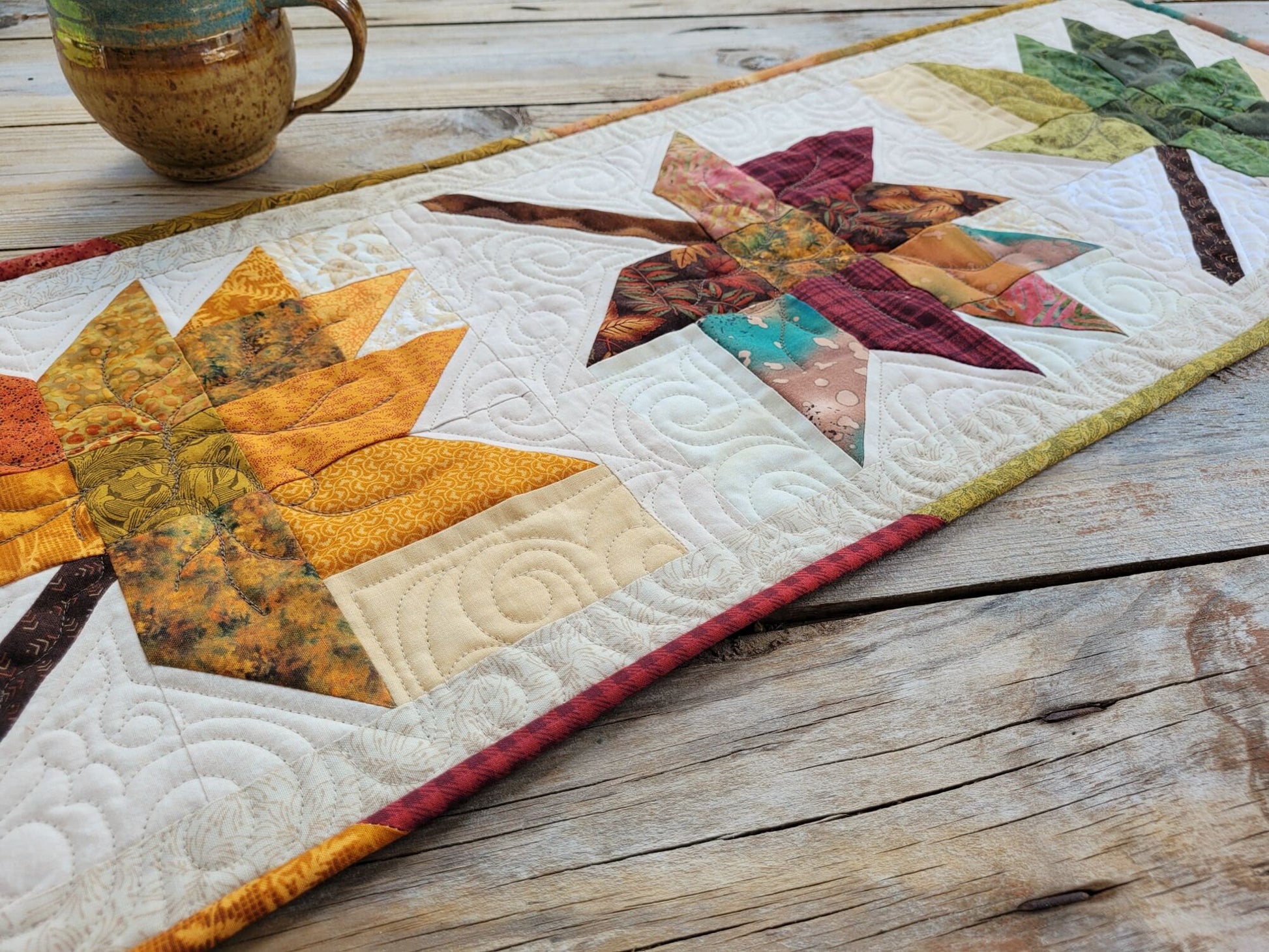 quilted table runner with fall leaves