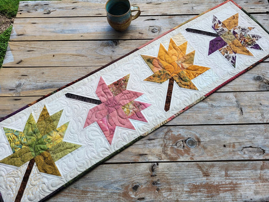 quilted table runner with fall leaves