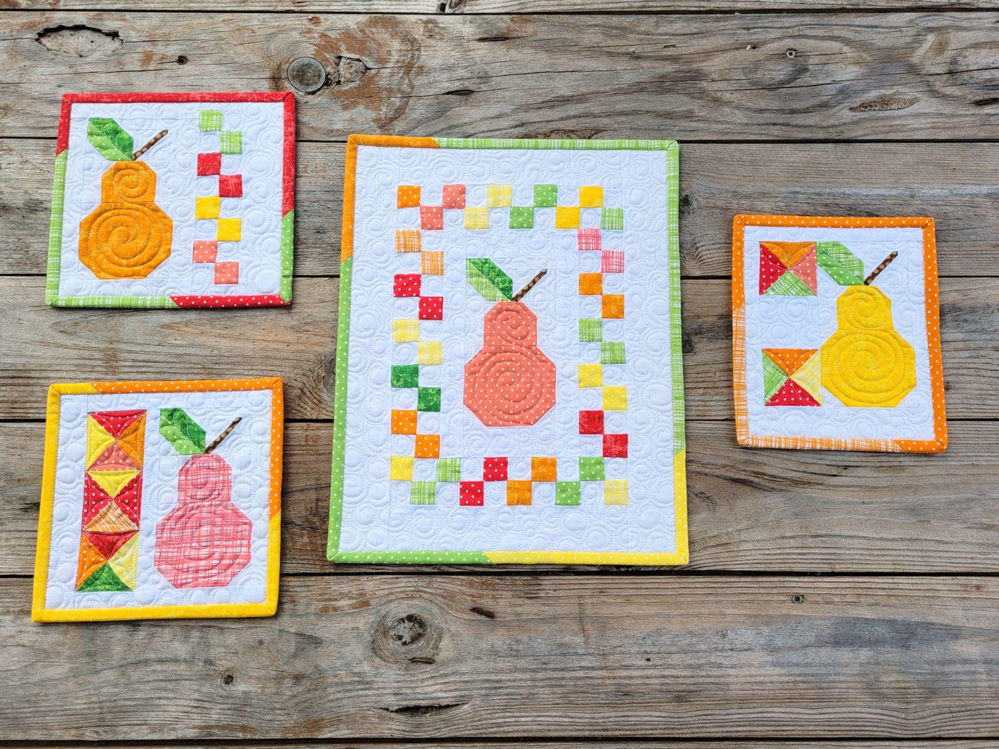 mini wall quilts in colorful scrappy patchwork pear fruit