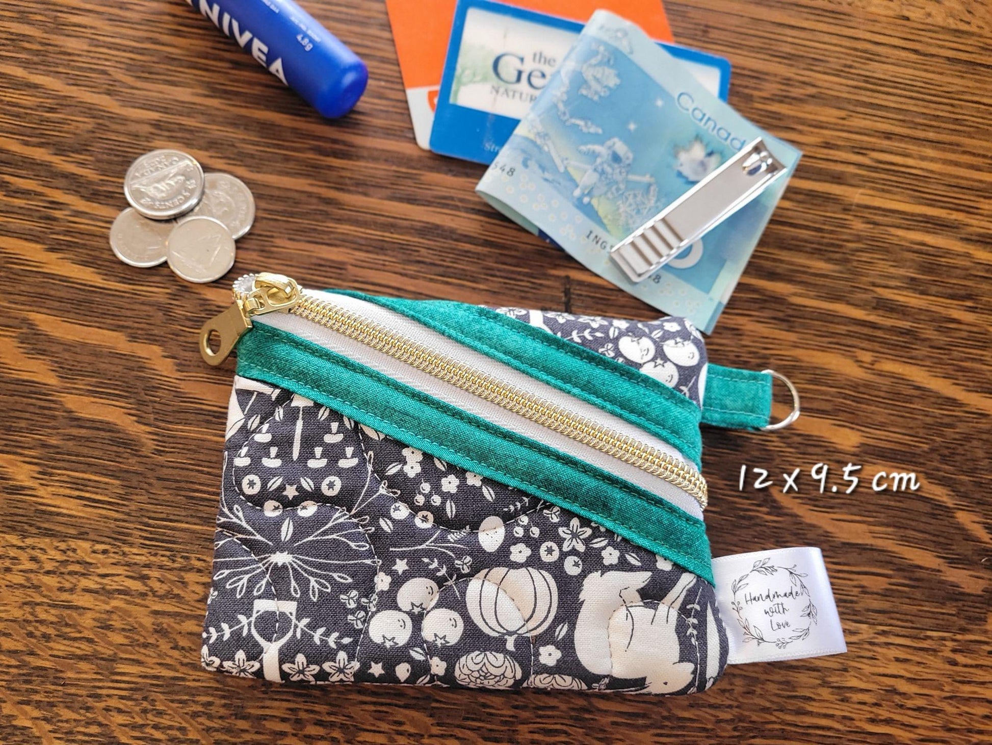 small size zipper pouch, shown with suggested use items: coins, money, cards, lip balm, etc.