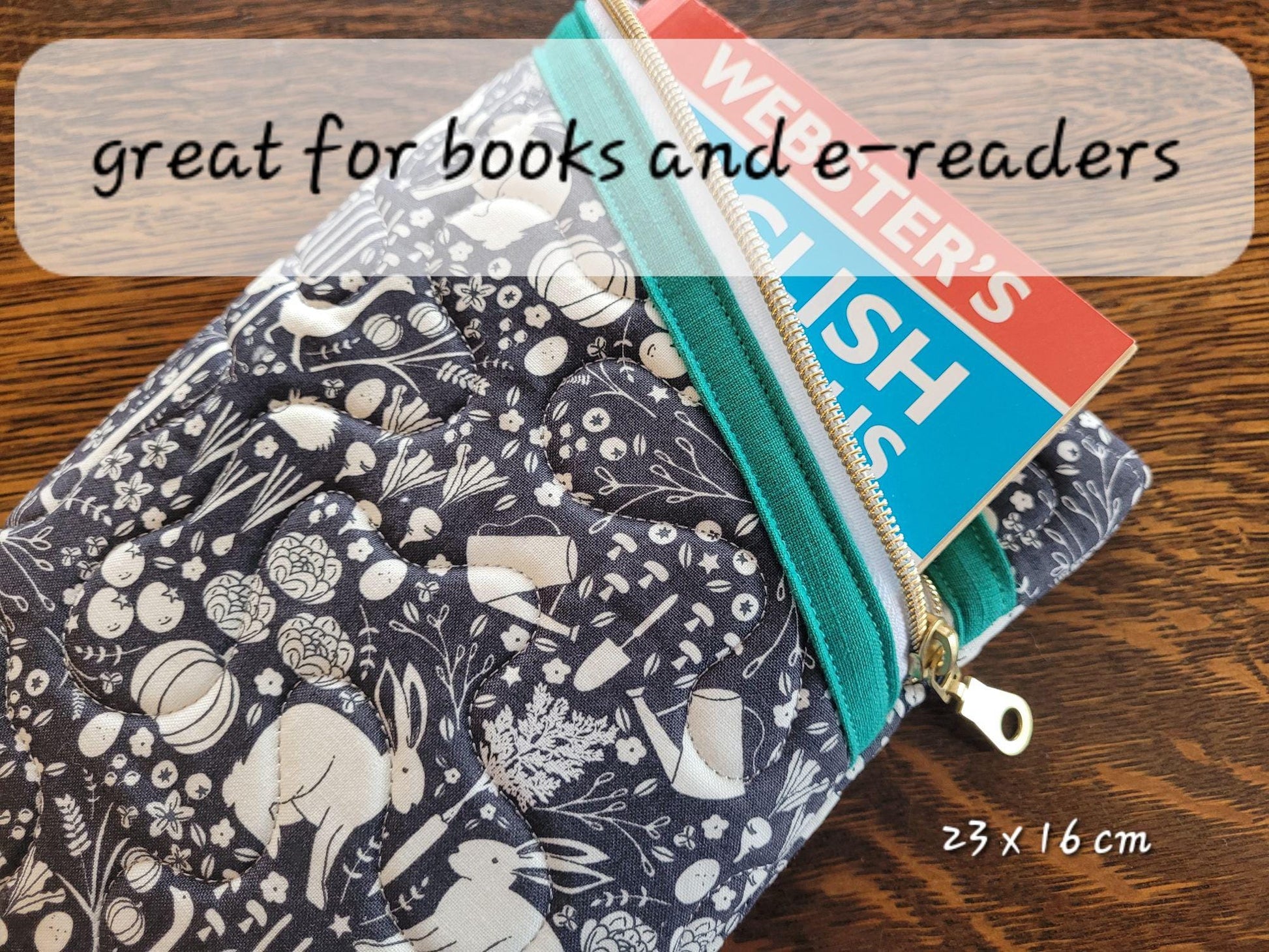 Quilted zipper pouch shown with a book. Perfect size for books and e-readers.