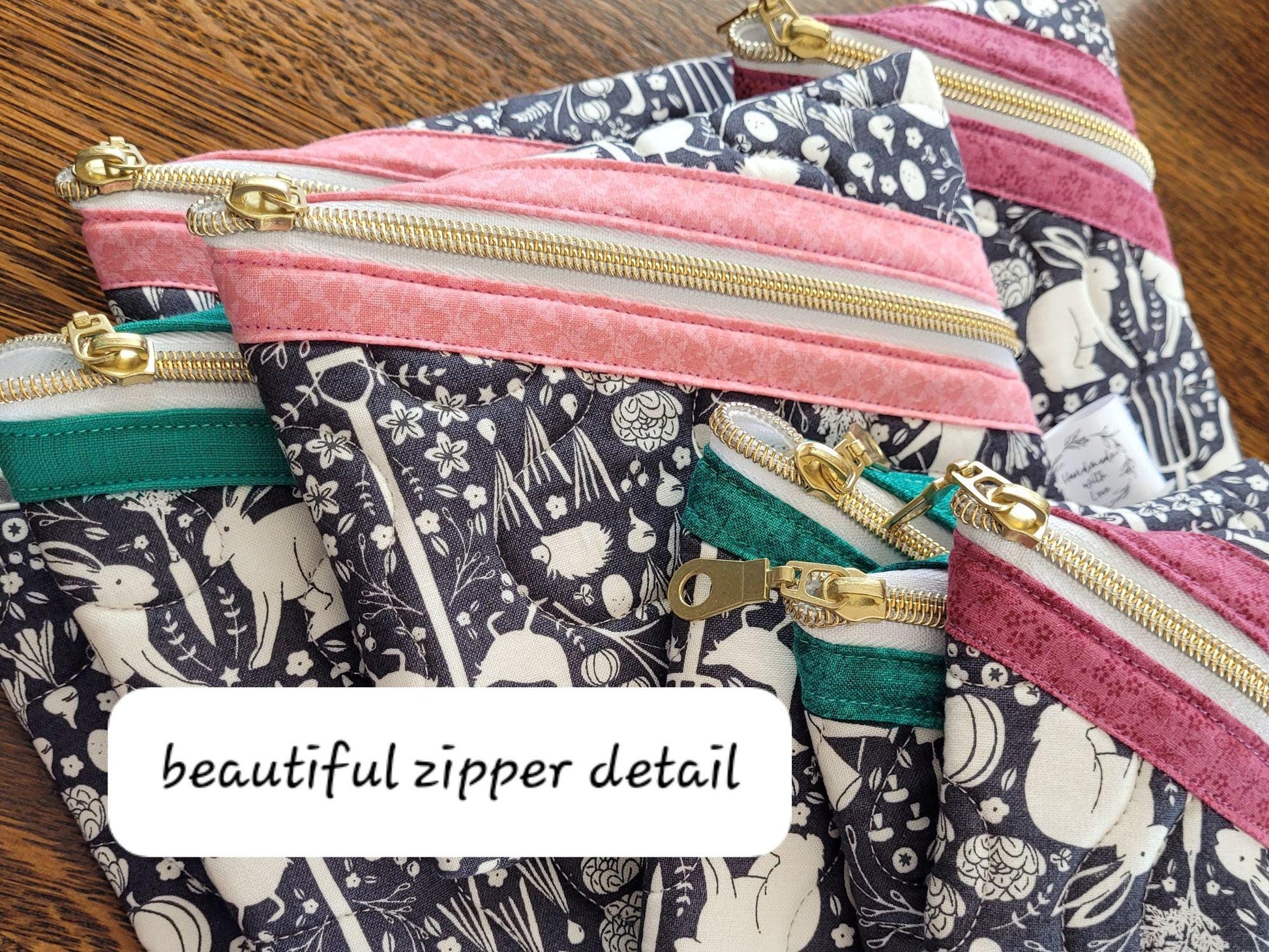 Quilted zipper pouches shown in group of the various sizes available.